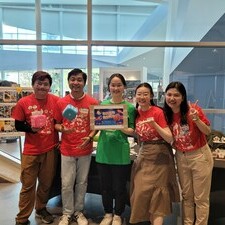 a group of volunteers pose for a photo