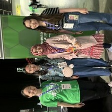 four people standing in front of a future energy systems banner