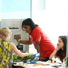 a volunteer interacts with kids