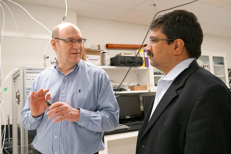 Future Energy Systems Director Larry Kostiuk in his lab with Deputy Director Amit Kumar.