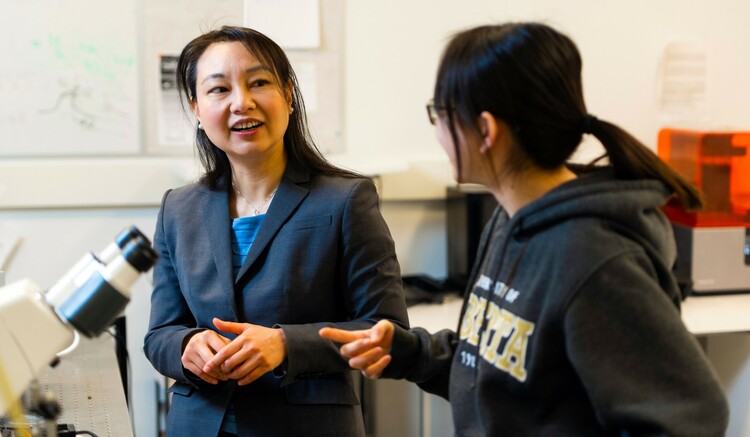 Engineering professor Amy Tsai (left) speaks with graduate student Junyi Yang. Tsai's research team is drilling down to the microscopic level to better understand how stored carbon behaves in salt-water aquifers deep underground. (Photo: John Ulan)