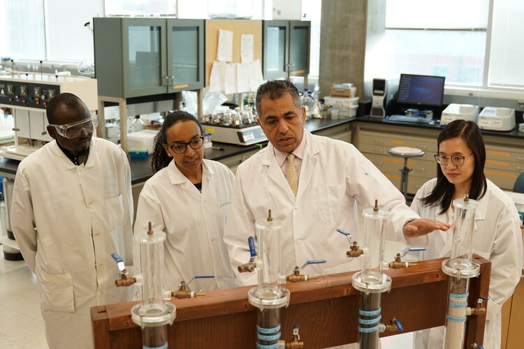 Mohamed Gamal El-Din (second right) with post-doctoral researchers in his U of A lab. Gamal El-Din led a study detailing a new process that efficiently removes one of the main toxic components of water used in oil sands operations.